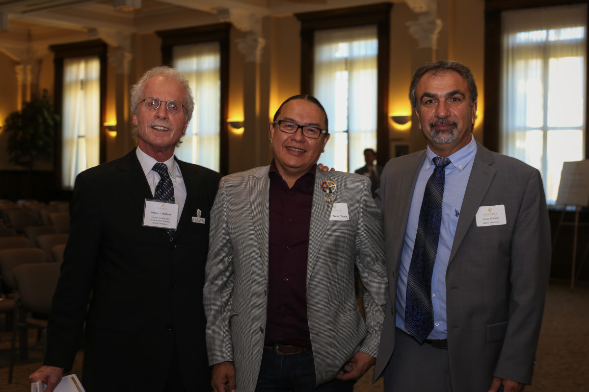 Fouad Elkardy and Gord Hoffman from Alberta Champions Board with Chiniki Chief Aaron Young