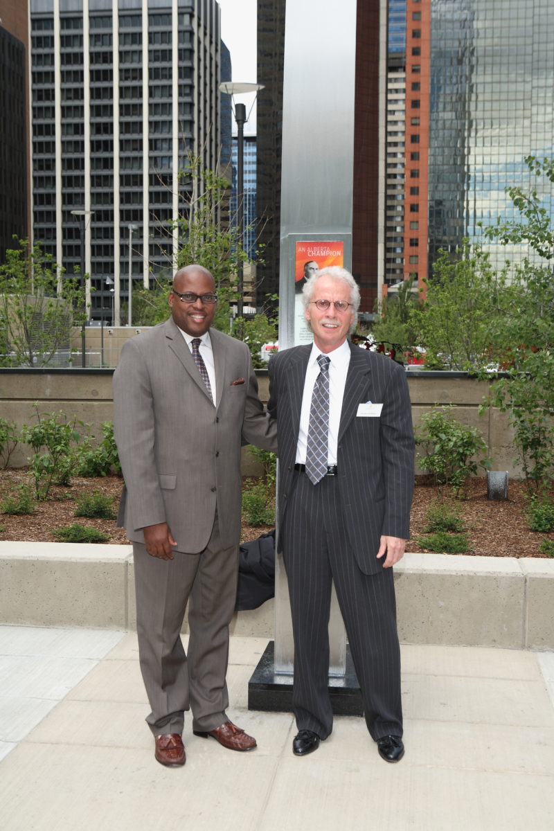 President Gordon Hoffman and Honourable Lindsay Blackett in front of Senator Lougheed's monument