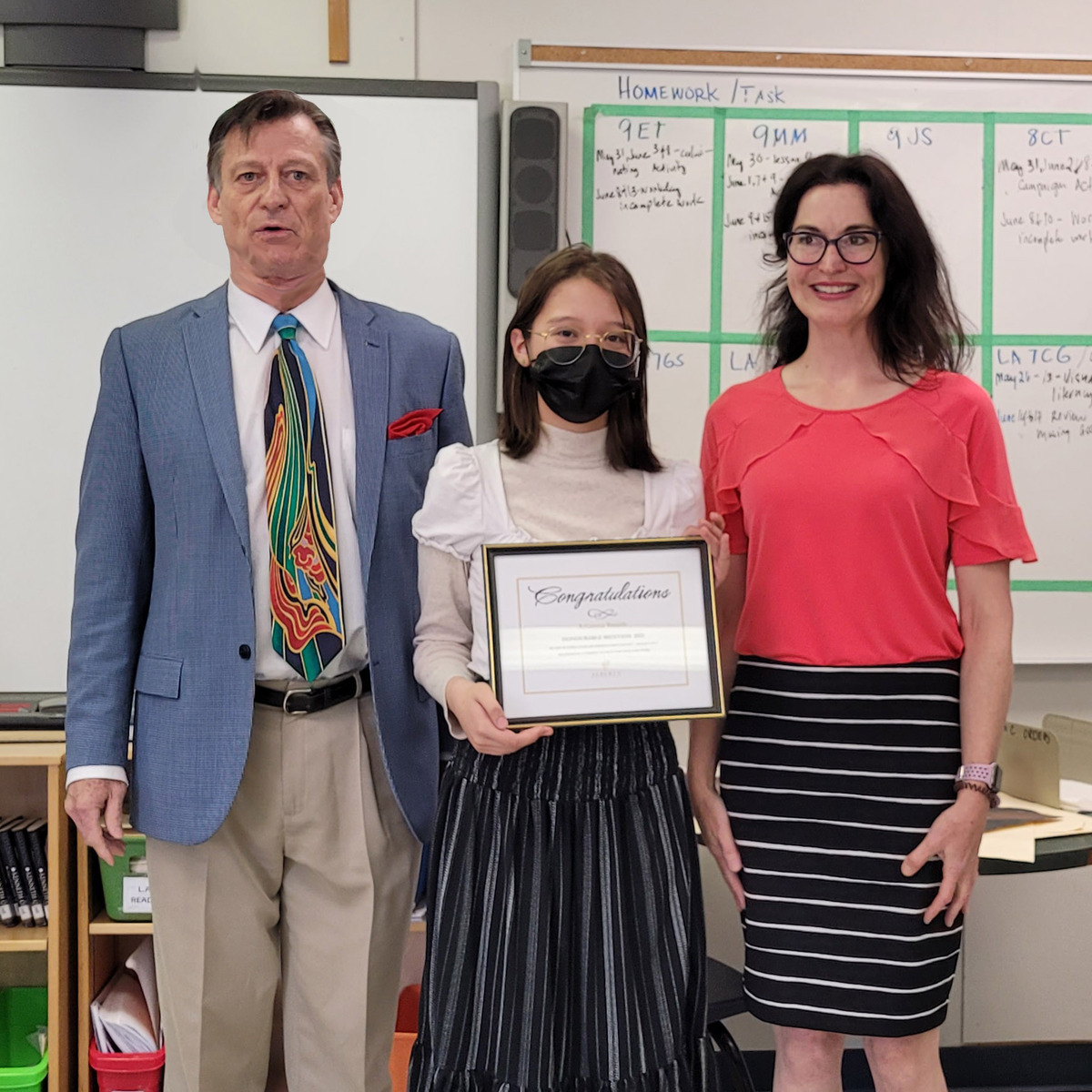 Mark Ruthenberg presenting Honourable Mention (Grades 7-9) Arianna Smith and teacher Arianna Smith and teacher Ms. Maureen MacSween at Holy Cross School